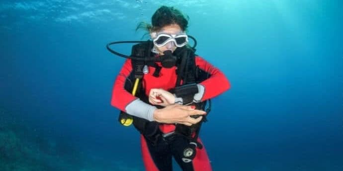 diver underwater with computer