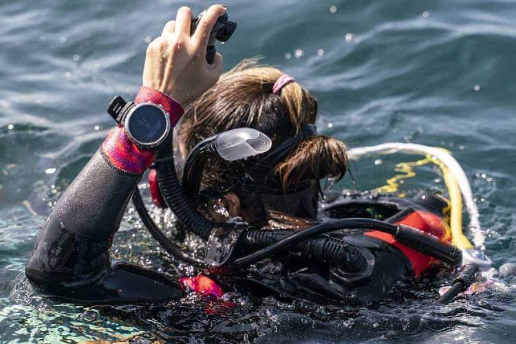 diver with diving computer watch