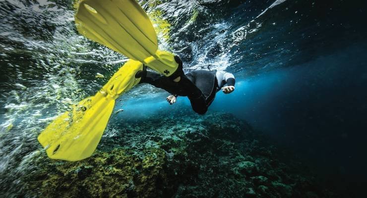 wear water shoes with flippers