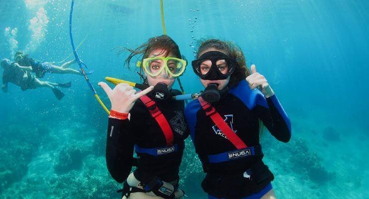 girls snuba diving